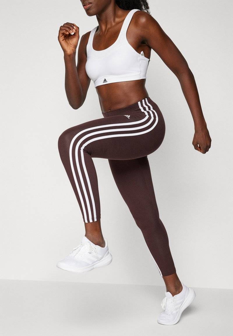 adidas Sportswear adidas Sportswear ESSENTIALS 3 STRIPES HIGH WAISTED - Leggings - shadow brown Schlussverkauf