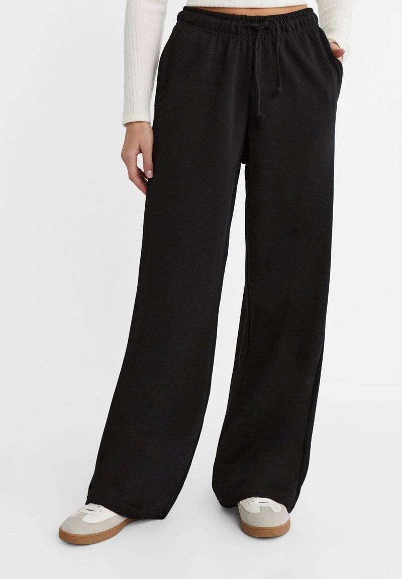 Stradivarius Stradivarius WIDE-LEG JOGGER - Tracksuit bottoms - black Angebote