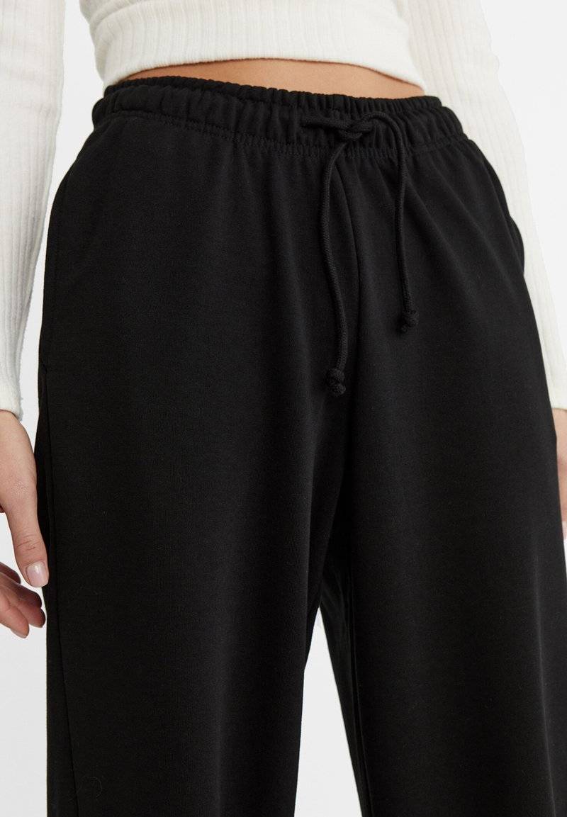 Stradivarius Stradivarius WIDE-LEG JOGGER - Tracksuit bottoms - black Angebote