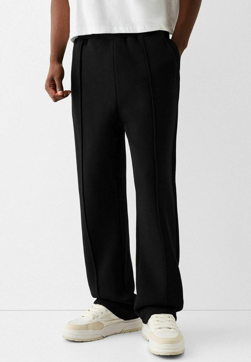 Bershka Bershka WIDE - Tracksuit bottoms - black