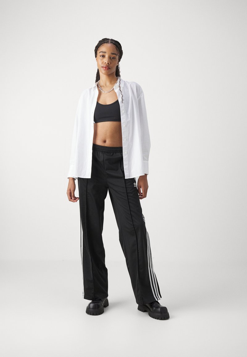 adidas Originals adidas Originals FBIRD LOOSE - Tracksuit bottoms - black Auslauf