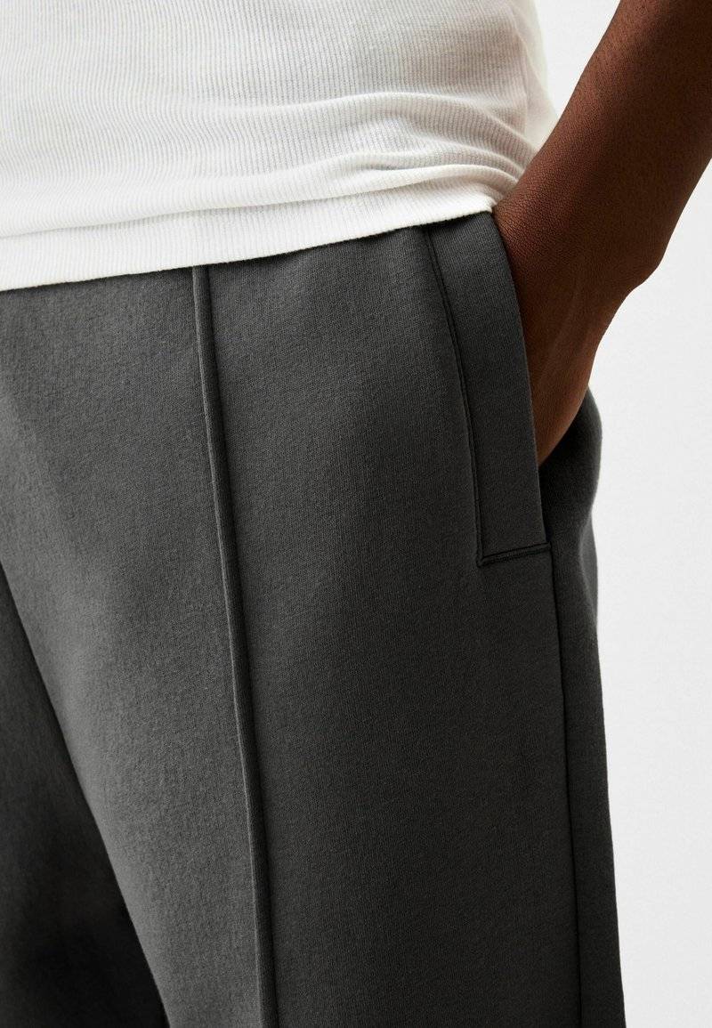 Bershka Bershka WIDE - Tracksuit bottoms - dark grey Meist gekauft