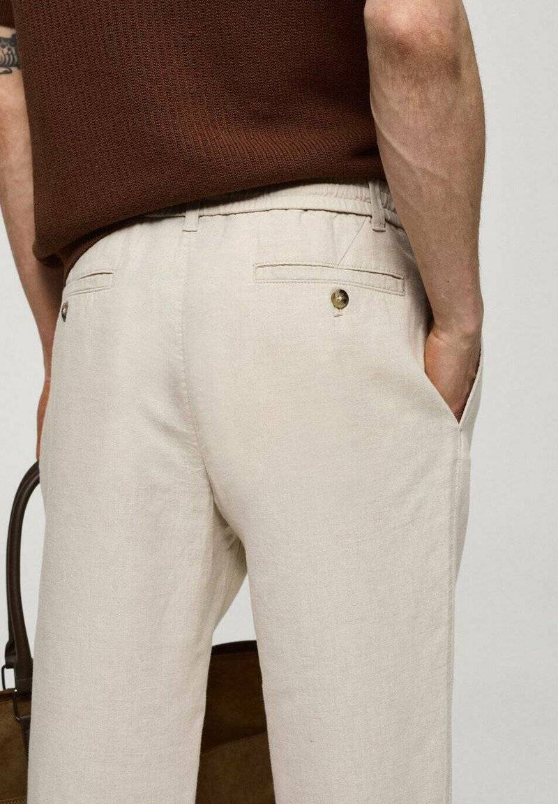 Mango Mango ROMELINO - Trousers - ecru 2025