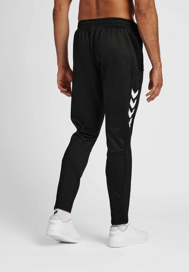 Hummel Hummel CORE XR TRAINING PANTS - Tracksuit bottoms - black Kostenloser Versand international