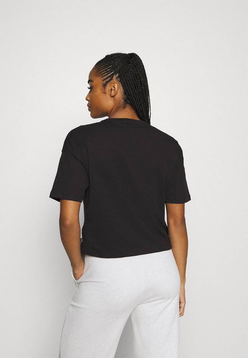 Puma Puma CROPPED LOGO TEE - Print T-shirt - puma black Black Friday Preise