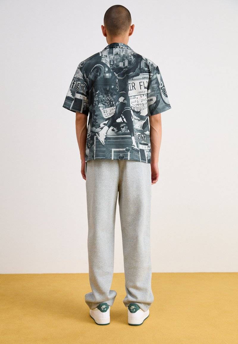 Nike Sportswear Nike Sportswear BUNGIE PANT - Tracksuit bottoms - grey heather Preisnachlass