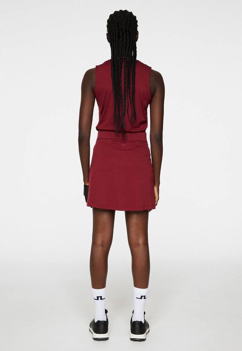 J.LINDEBERG Sports J.LINDEBERG Sports AMELIE MID - Sports skirt - cabernet Limitierter Zeitrabatt