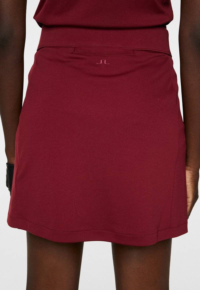 J.LINDEBERG Sports J.LINDEBERG Sports AMELIE MID - Sports skirt - cabernet Limitierter Zeitrabatt