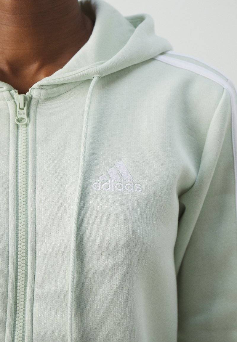adidas Sportswear adidas Sportswear ESSENTIALS 3 STRIPES FULL ZIP HOODIE - Zip-up sweatshirt - linen green Weihnachtsangebot