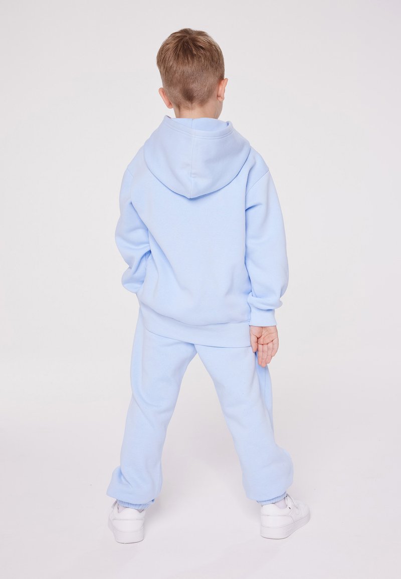 Champion Champion EXCLUSIVE PANT UNISEX - Tracksuit bottoms - light blue Großer Ausverkauf