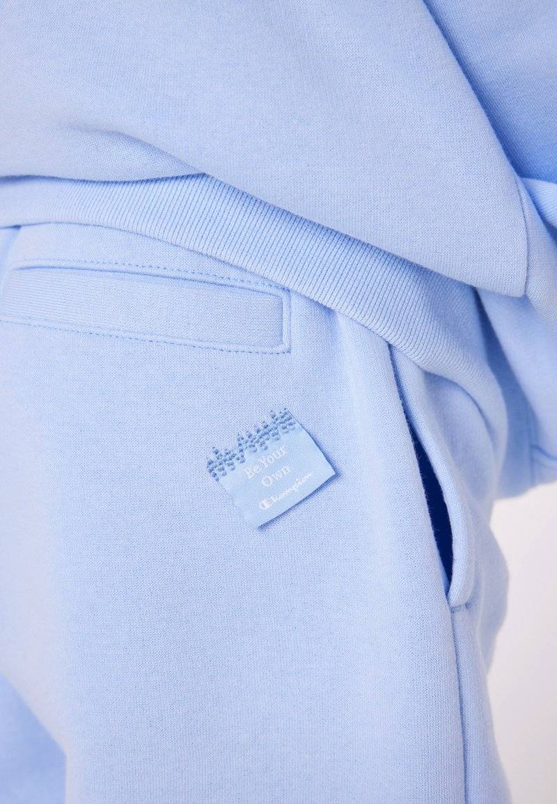 Champion Champion EXCLUSIVE PANT UNISEX - Tracksuit bottoms - light blue Großer Ausverkauf