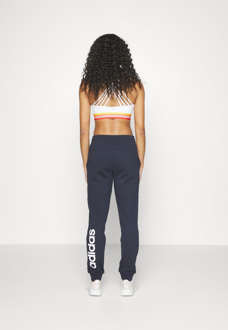adidas Sportswear adidas Sportswear ESSENTIALS LINEAR CUFFED - Tracksuit bottoms - legend ink Zeitlich begrenztes Angebot