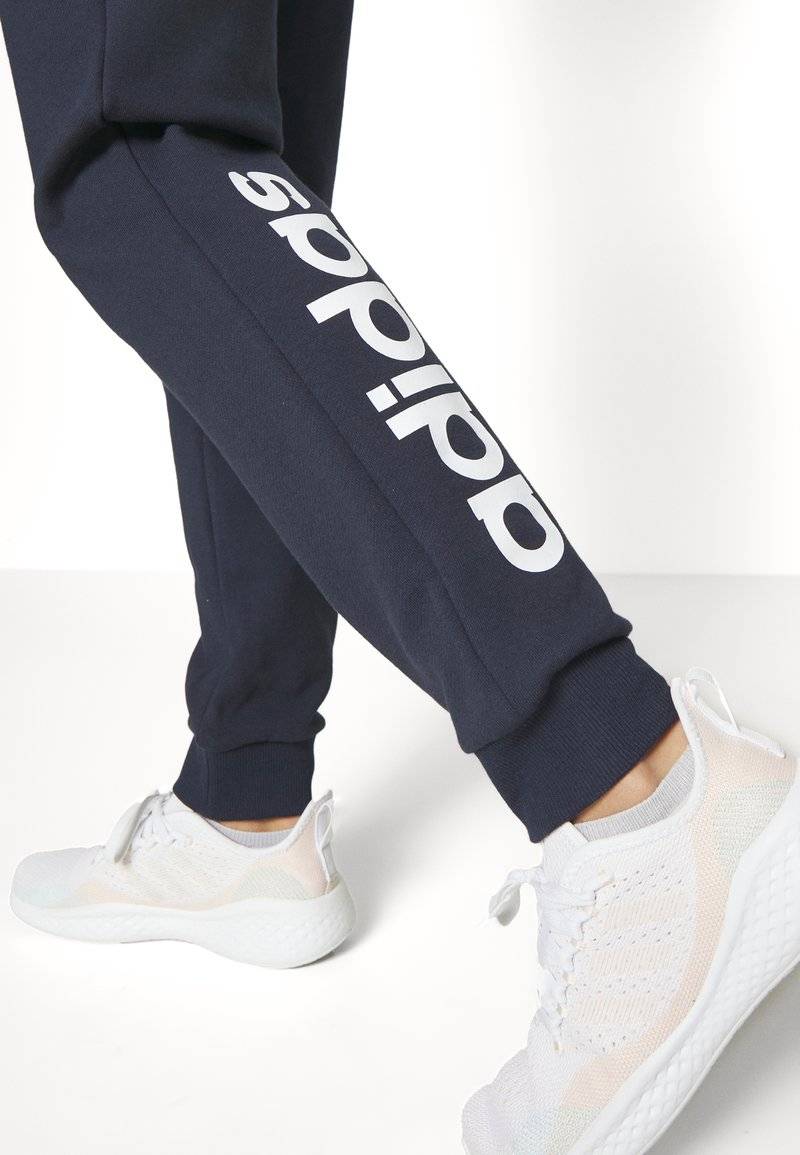 adidas Sportswear adidas Sportswear ESSENTIALS LINEAR CUFFED - Tracksuit bottoms - legend ink Zeitlich begrenztes Angebot