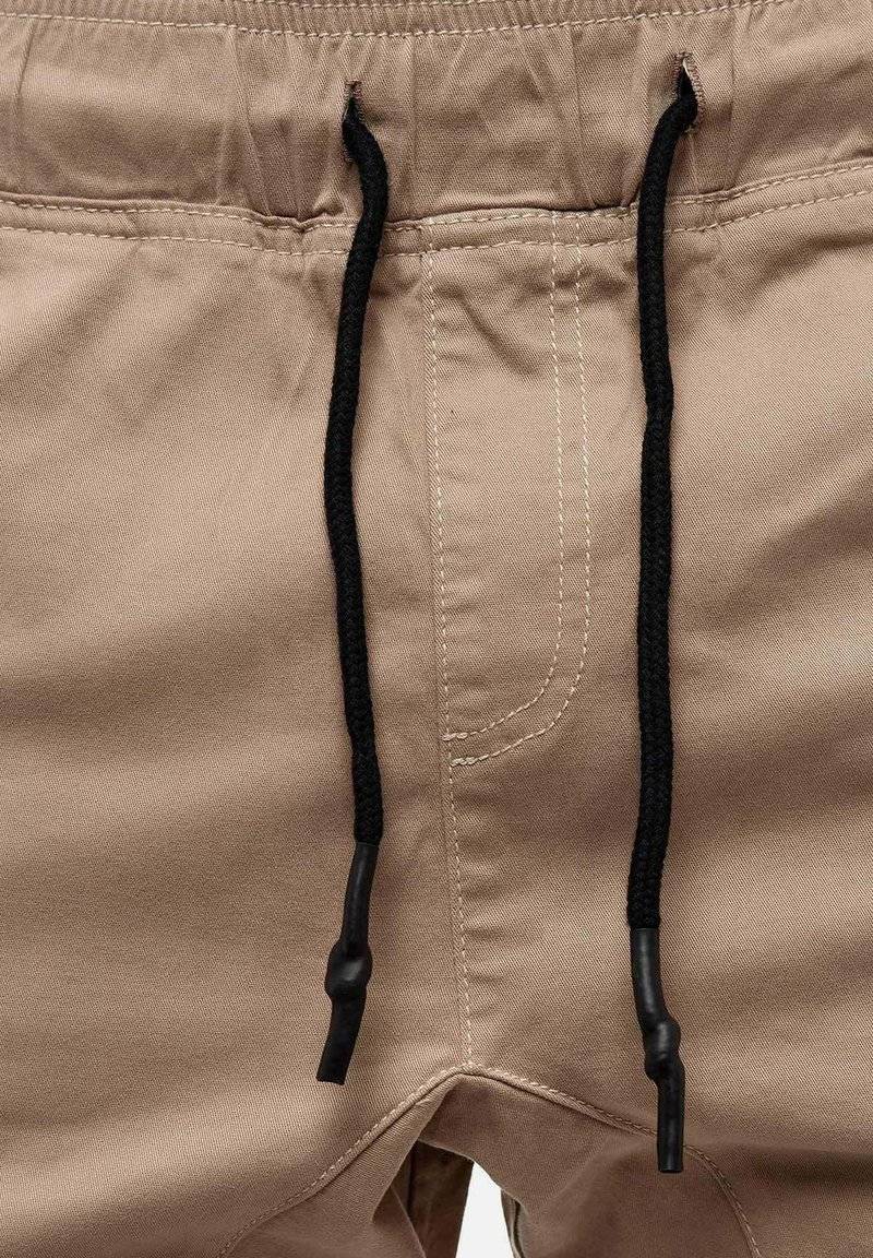 Tazzio Tazzio Cargo trousers - beige Tägliche Deals