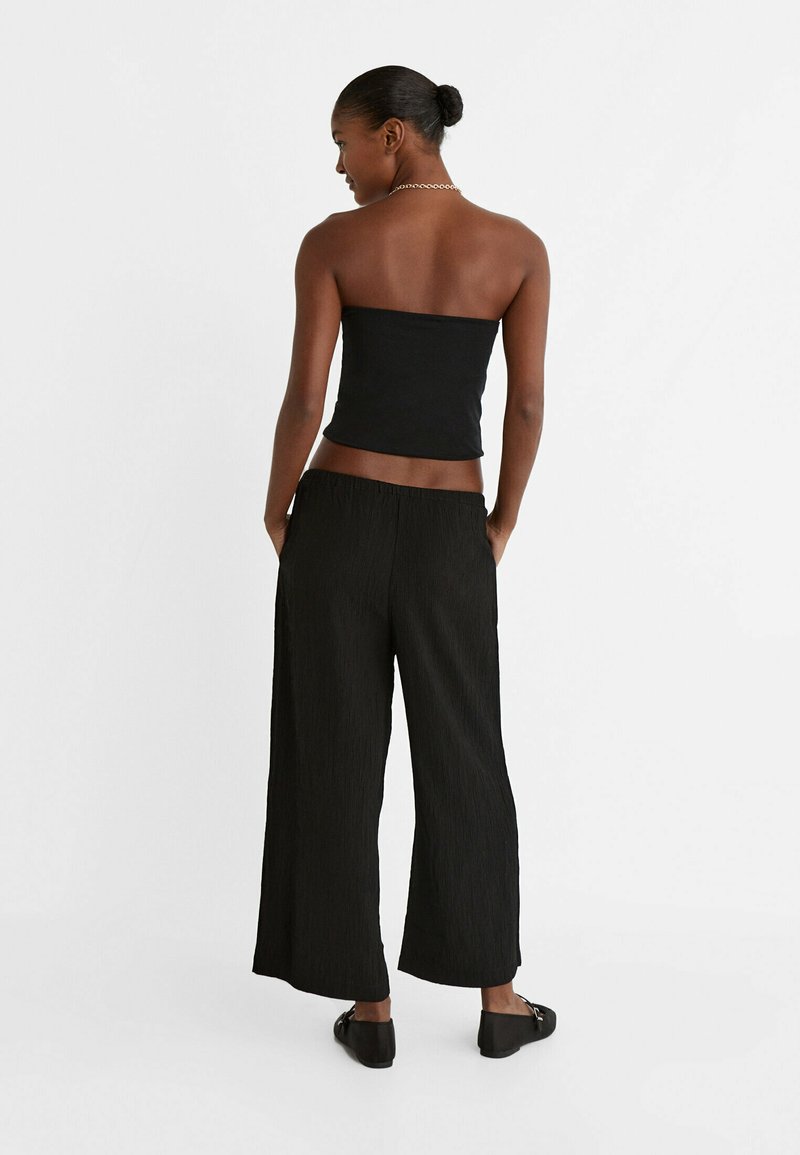 Stradivarius Stradivarius FLOWING CULOTTES - Trousers - black Vierteljährliche Förderung